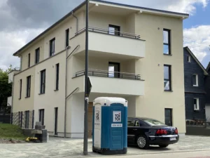 Mehrfamilienhaus mit Gewerbeeinheit in Siegen – Tragwerksplanung, Statik und Projektleitung bis zur schlüsselfertigen Übergabe